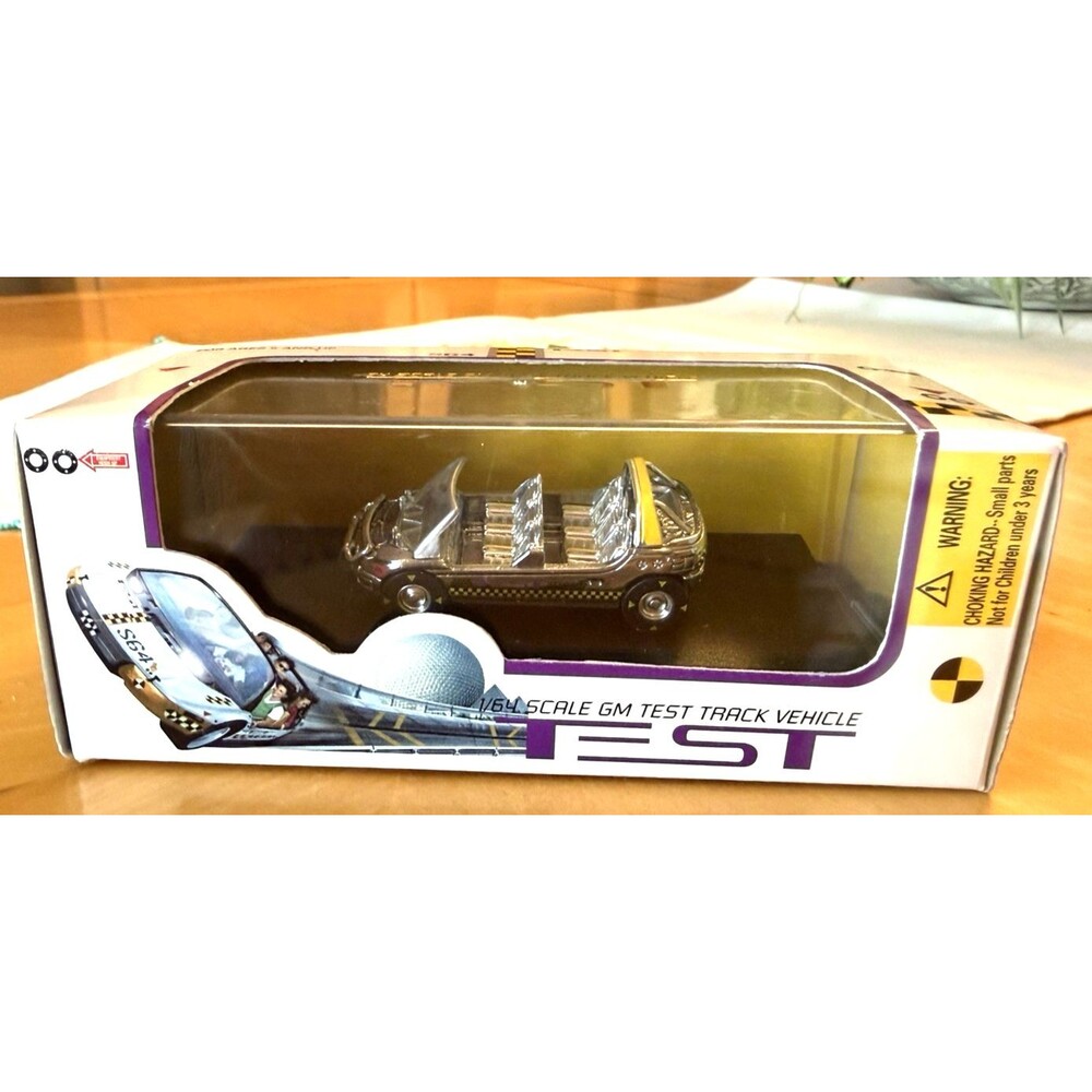 NEW DISNEY WORLD 1/64 SCALE TEST TRACK GM SILVER COLORED VEHICLE MINT IN BOX
